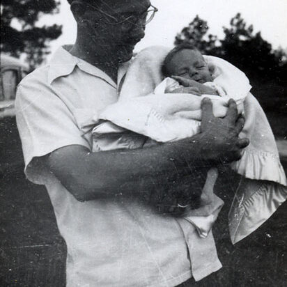 Walter Windsor holds baby Billy outside in Columbus in 1948.