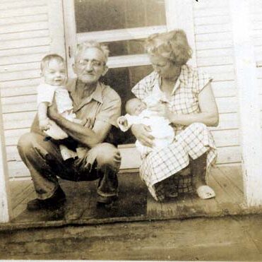 Grandpa Johnson holding Billy Windsor with Grandma Johnson