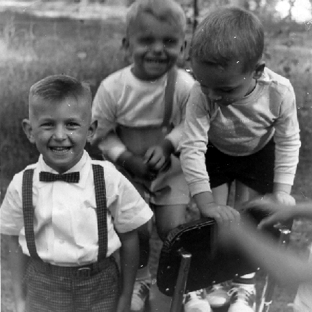 Billy Windsor, Tony Windsor, and Static Atkinson playing in yard in 1951